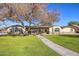 Beautiful home exterior with landscaping and walkway at 6614 W Sweetwater Ave, Glendale, AZ 85304