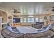 Formal room with a grand piano, hardwood floors and wood columns at 6614 W Sweetwater Ave, Glendale, AZ 85304