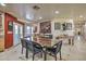 Rustic dining area with a live-edge wood table and seating for six at 6614 W Sweetwater Ave, Glendale, AZ 85304