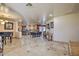 Open dining area with large wood table and view into kitchen at 6614 W Sweetwater Ave, Glendale, AZ 85304