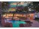 Inviting pool and outdoor entertaining area with string lights at 6614 W Sweetwater Ave, Glendale, AZ 85304