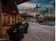 Relaxing backyard patio with seating area and pool views at 6614 W Sweetwater Ave, Glendale, AZ 85304