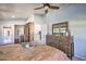 Bedroom with built-in wardrobe, dresser and access to backyard at 6614 W Sweetwater Ave, Glendale, AZ 85304