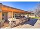 Outdoor kitchen with bar seating, grill, and sink at 6614 W Sweetwater Ave, Glendale, AZ 85304
