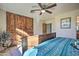 Bedroom with built-in wooden wardrobe and a double bed at 6614 W Sweetwater Ave, Glendale, AZ 85304