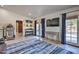Game room with a large screen TV and access to backyard at 6614 W Sweetwater Ave, Glendale, AZ 85304