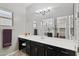 Double vanity bathroom with large mirror and glass shower at 41758 W Cribbage Rd, Maricopa, AZ 85138
