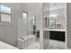 Spa-like bathroom with walk-in shower and separate tub at 41758 W Cribbage Rd, Maricopa, AZ 85138