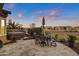 Spacious backyard patio with hot tub, seating area and lovely sunset views at 41758 W Cribbage Rd, Maricopa, AZ 85138