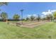 Two bocce ball courts with benches at 41758 W Cribbage Rd, Maricopa, AZ 85138