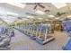 Modern fitness center with a variety of cardio and strength training equipment at 41758 W Cribbage Rd, Maricopa, AZ 85138