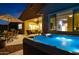 Relaxing hot tub on backyard patio at night at 41758 W Cribbage Rd, Maricopa, AZ 85138