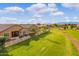Aerial view showcasing home's backyard and golf course views at 41758 W Cribbage Rd, Maricopa, AZ 85138