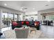 Open living room and kitchen with access to backyard patio at 41758 W Cribbage Rd, Maricopa, AZ 85138