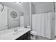 Clean bathroom with single sink vanity, toilet and shower/tub combo at 41758 W Cribbage Rd, Maricopa, AZ 85138