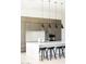 Modern kitchen with island, stainless steel appliances, and sleek pendant lighting at 6271 E Horseshoe Rd, Paradise Valley, AZ 85253