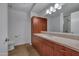 Bathroom with single vanity, wood cabinets, and tiled floors at 7137 E Rancho Vista Dr # 2007, Scottsdale, AZ 85251