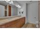 Modern bathroom with double vanity, granite countertop, and tiled floors at 7137 E Rancho Vista Dr # 2007, Scottsdale, AZ 85251