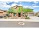 Two-story house with stone accents and landscaped front yard at 26886 N 90Th Ave, Peoria, AZ 85383