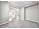 Bright hallway with carpeted floors and access to other rooms at 26886 N 90Th Ave, Peoria, AZ 85383