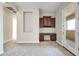 Home office with built-in desk and cabinets, and a private alcove at 26886 N 90Th Ave, Peoria, AZ 85383
