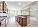 Eat-in kitchen features granite counters, custom cabinetry, and views to Gathering room at 26886 N 90Th Ave, Peoria, AZ 85383