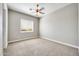 Spacious bedroom featuring a ceiling fan and window coverings at 26886 N 90Th Ave, Peoria, AZ 85383
