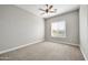 Well-lit bedroom with ceiling fan and window at 26886 N 90Th Ave, Peoria, AZ 85383