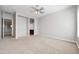 Bright bedroom with carpeted floors and ceiling fan at 26886 N 90Th Ave, Peoria, AZ 85383