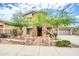 Two-story house with stone accents and landscaped front yard at 26886 N 90Th Ave, Peoria, AZ 85383