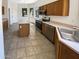 Modern kitchen features stainless steel appliances and an island at 9684 N 97Th Ln, Peoria, AZ 85345