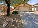 Single-story home with front yard and driveway at 9684 N 97Th Ln, Peoria, AZ 85345