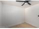 Well-lit bedroom with ceiling fan and light wood floors at 20836 E Pickett St, Queen Creek, AZ 85142