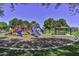 Community playground with slides and playsets at 17226 W Maui Ln, Surprise, AZ 85388