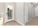 A clean hallway with light walls and wood-look floors at 30056 N 132Nd Dr, Peoria, AZ 85383