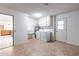 Bright laundry room with washer, dryer, cabinets, and sink at 19829 N Welk Dr, Sun City, AZ 85373