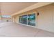 Covered patio with sliding glass doors leading to the interior at 19829 N Welk Dr, Sun City, AZ 85373