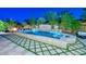 Expansive backyard oasis with a large pool and fire pit at 12789 W Via Caballo Blanco --, Peoria, AZ 85383