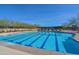 Community lap pool with ample lounge space at 12789 W Via Caballo Blanco --, Peoria, AZ 85383