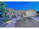 Two-story home with stone accents and a landscaped yard at 12789 W Via Caballo Blanco --, Peoria, AZ 85383