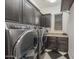 Functional laundry room with modern washer and dryer at 12789 W Via Caballo Blanco --, Peoria, AZ 85383