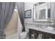 Modern bathroom with a gray vanity and a large mirror at 12789 W Via Caballo Blanco --, Peoria, AZ 85383