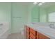 Double vanity bathroom with light green walls at 29759 N Desert Angel Dr, San Tan Valley, AZ 85143