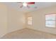 Bright bedroom with carpet flooring and two windows at 29759 N Desert Angel Dr, San Tan Valley, AZ 85143