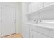 Laundry room with washer, dryer, and storage cabinets at 29759 N Desert Angel Dr, San Tan Valley, AZ 85143