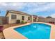 Inviting kidney-shaped pool with a spacious patio at 29759 N Desert Angel Dr, San Tan Valley, AZ 85143
