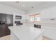 Well-equipped kitchen, featuring white cabinets and black appliances at 29759 N Desert Angel Dr, San Tan Valley, AZ 85143