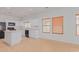 Kitchen boasts white cabinets, black appliances, and tile floors at 29759 N Desert Angel Dr, San Tan Valley, AZ 85143