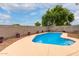 Inviting kidney-shaped pool with a spacious patio at 29759 N Desert Angel Dr, San Tan Valley, AZ 85143