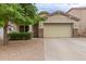 House exterior with a two car garage and landscaped yard at 29759 N Desert Angel Dr, San Tan Valley, AZ 85143